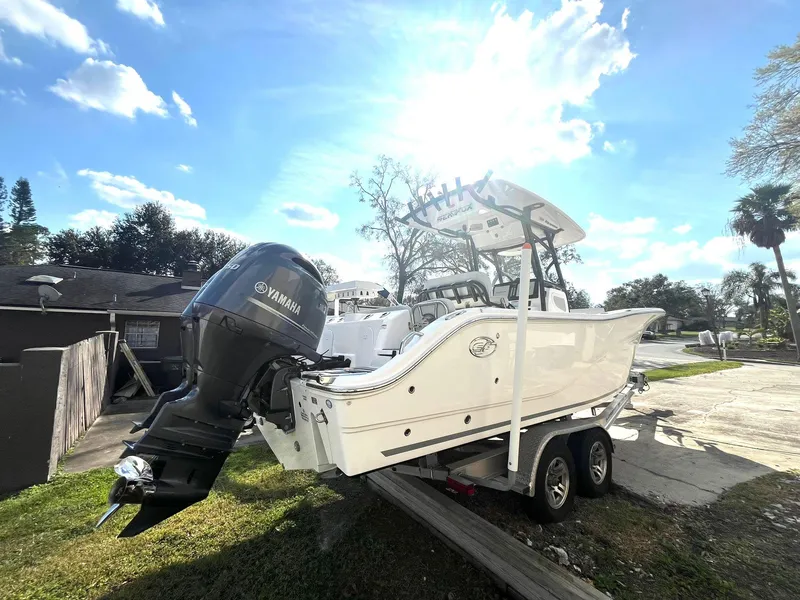 Slide: The Image of 2023 Sea Fox 268 Commander boat with Yamaha engine on trailer, sunny day. - 7