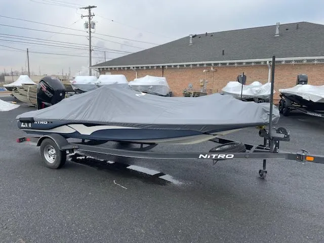 Slide: The Image of 2023 Nitro Z17 boat with cover on trailer in parking lot. - 3