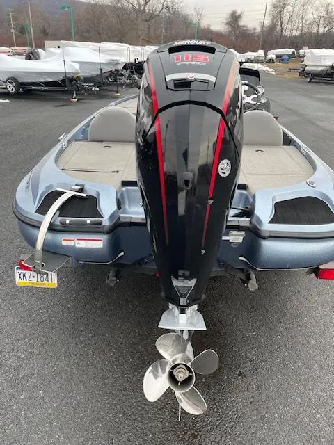 Slide: The Image of 2023 Nitro Z17 boat with Mercury 115 outboard motor, parked on asphalt. - 5