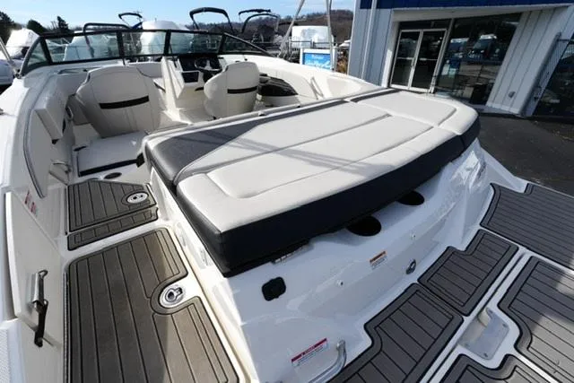Slide: The Image of 2023 Sea Ray SPX 210 boat interior with spacious seating and modern design. - 13