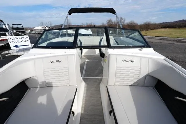 Slide: The Image of 2023 Sea Ray SPX 210 boat interior with white seating and open deck view. - 8