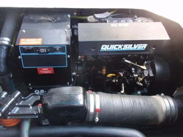 Slide: The Image of Engine compartment of a 1994 Sea Ray 330 Sundancer with Quicksilver components. - 28