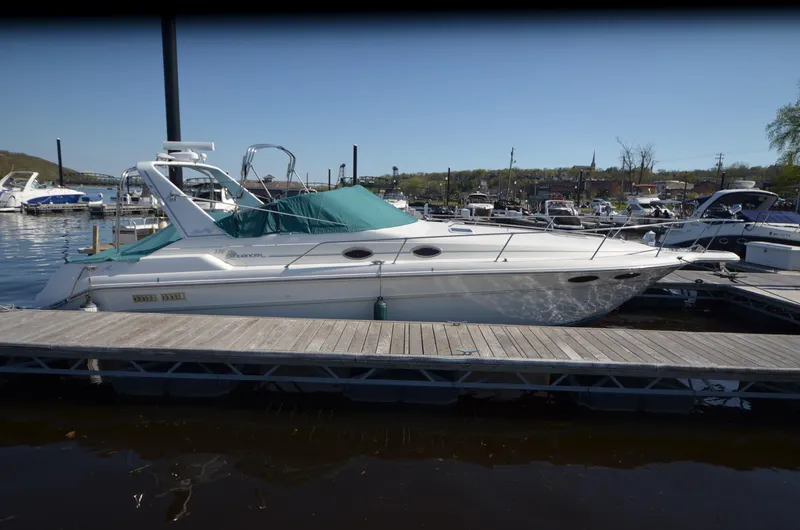Slide: The Image of 1994 Sea Ray 330 Sundancer docked at marina, side view. - 5