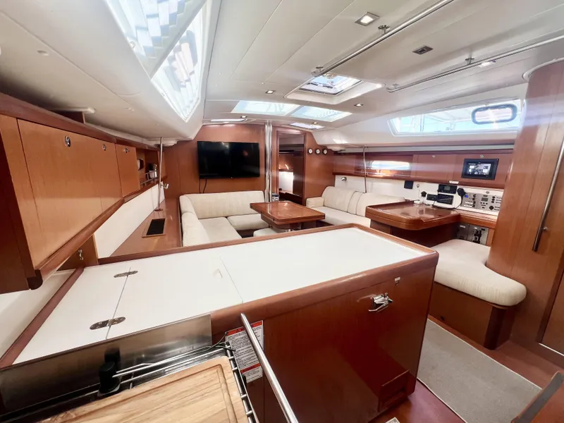 Slide: The Image of Luxurious interior of 2008 Beneteau 46 yacht with modern amenities and elegant wood finish. - 14