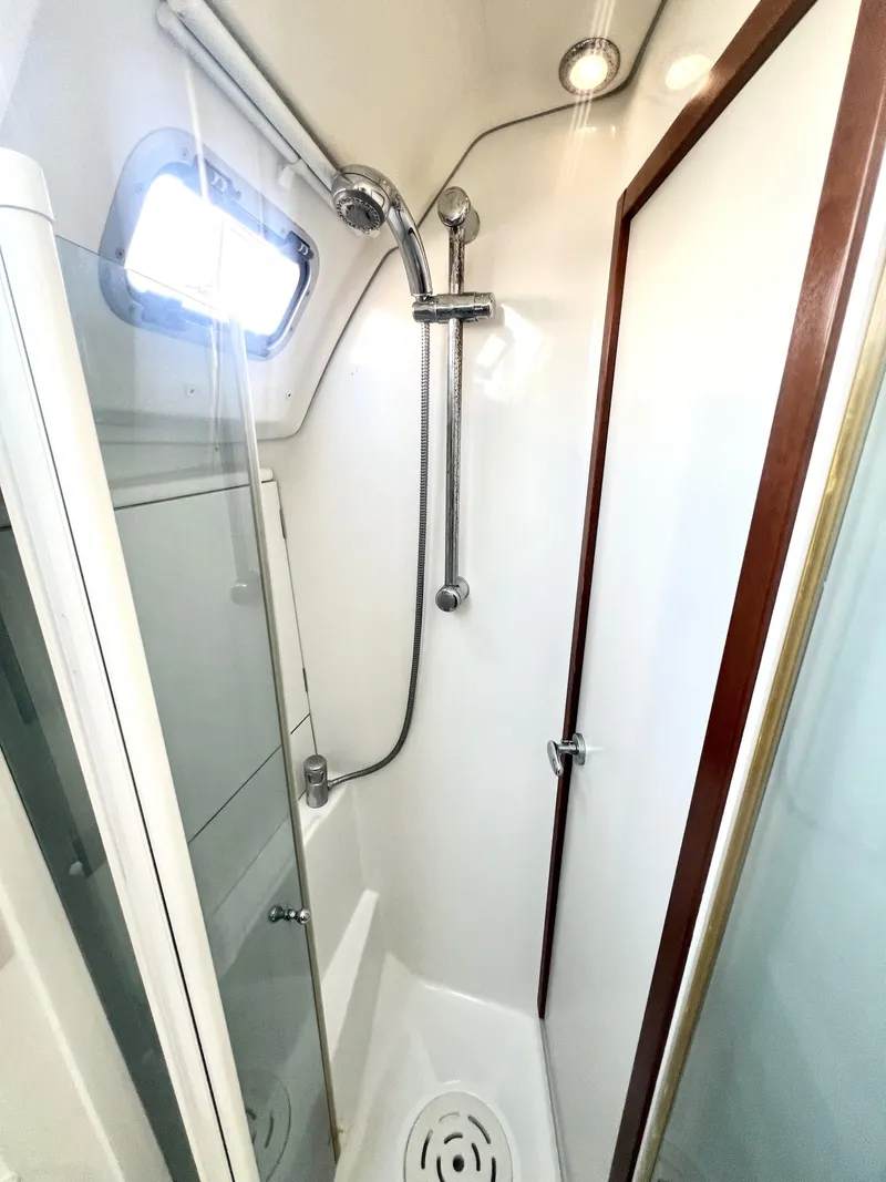 Slide: The Image of Beneteau 46 2008 yacht shower with modern fixtures and natural light. - 19