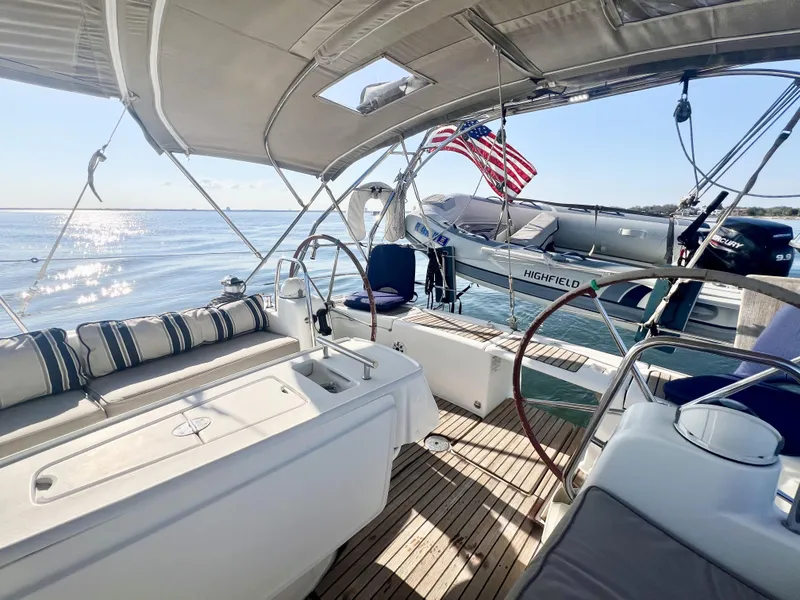 Slide: The Image of Beneteau 46 sailboat cockpit, 2008 model, with ocean view and American flag. - 4