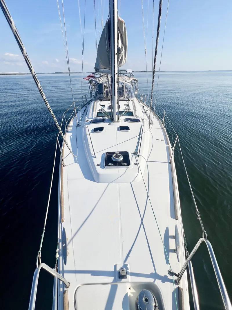 Slide: The Image of 2008 Beneteau 46 sailboat on calm water, viewed from the deck. - 7