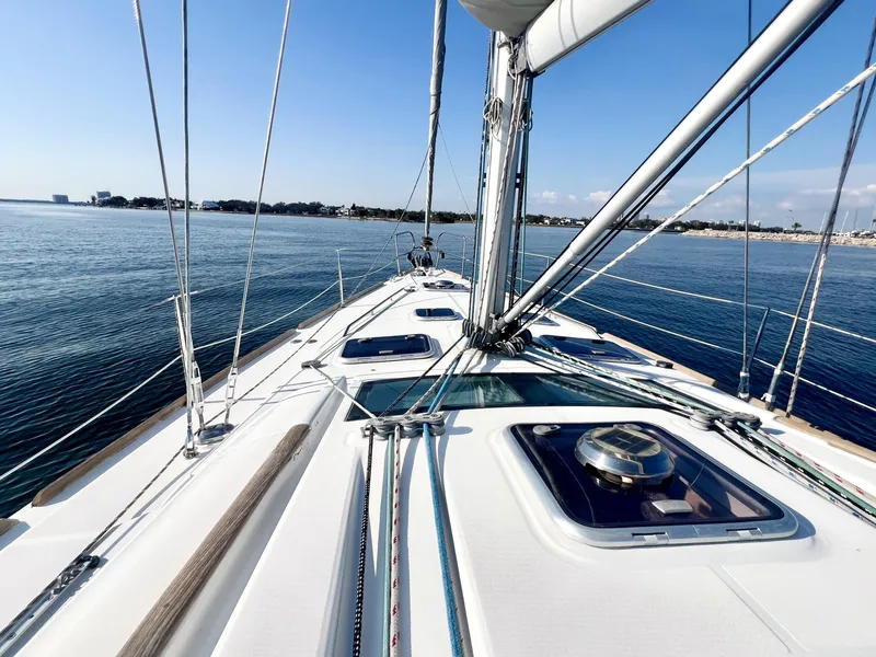 Slide: The Image of 2008 Beneteau 46 sailboat deck view on calm water, clear sky. - 8