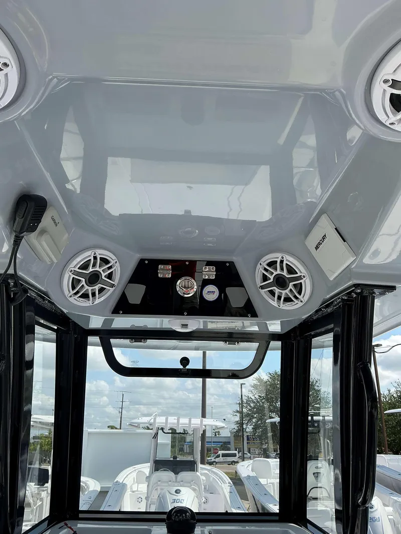 Slide: The Image of 2025 Sportsman 267 Masters boat interior with speakers and control panel. - 13