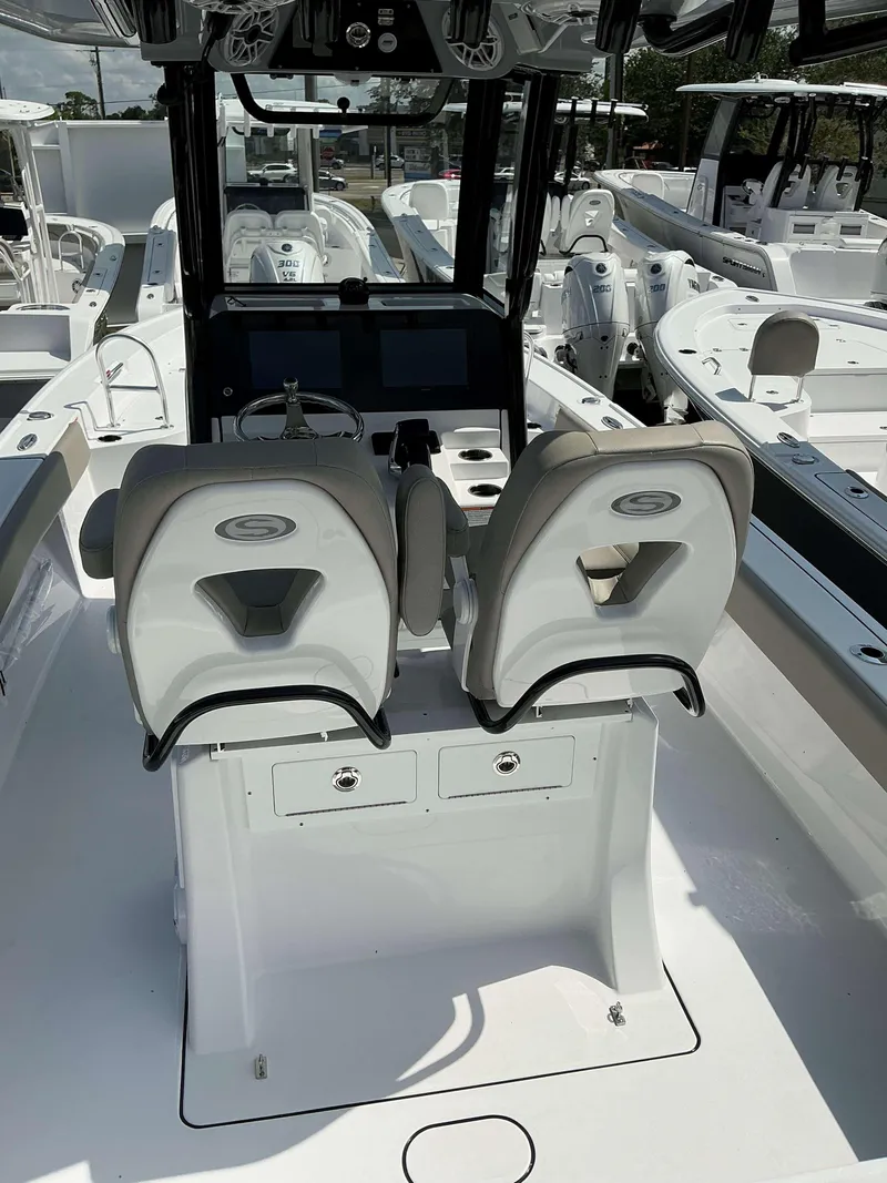 Slide: The Image of 2025 Sportsman 267 Masters boat interior with dual seats and control panel. - 15