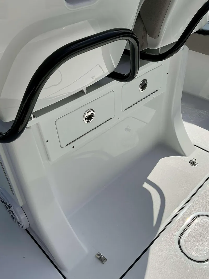 Slide: The Image of 2025 Sportsman 267 Masters boat interior with storage compartments and seating area. - 17