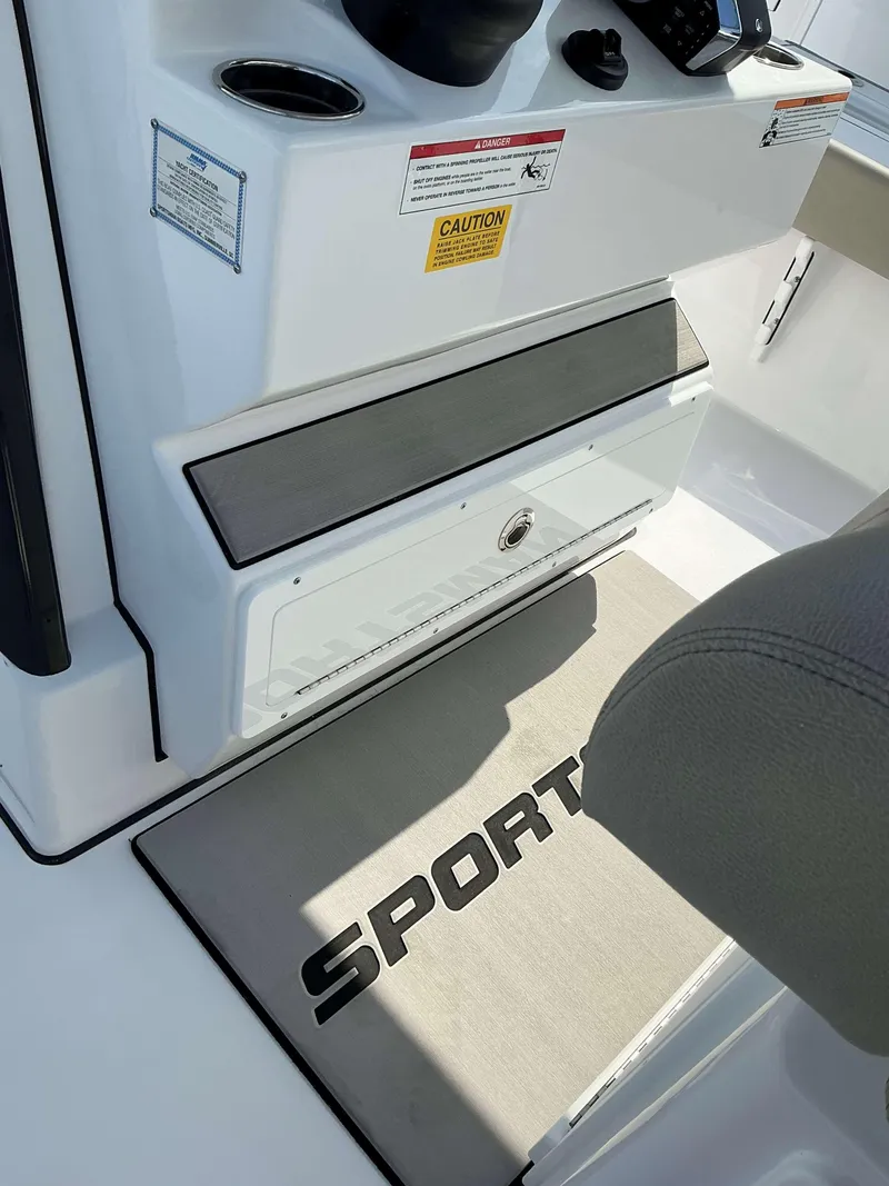 Slide: The Image of 2025 Sportsman 267 Masters boat interior with branded mat and control panel. - 5