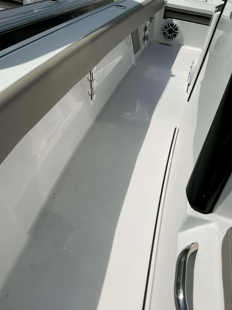 Slide: The Image of Interior view of 2025 Sportsman 267 Masters boat, featuring sleek design and speaker system. - 8
