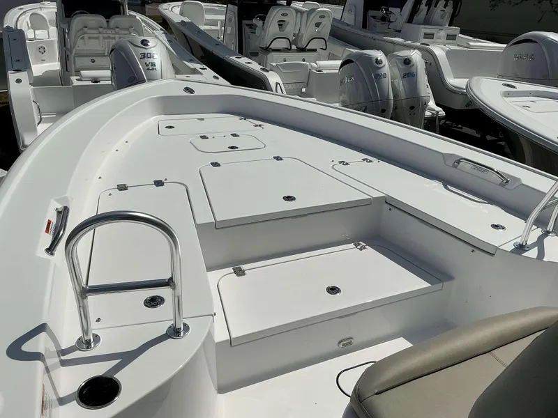 Slide: The Image of 2025 Sportsman 267 Masters boat interior with seating and storage compartments. - 9