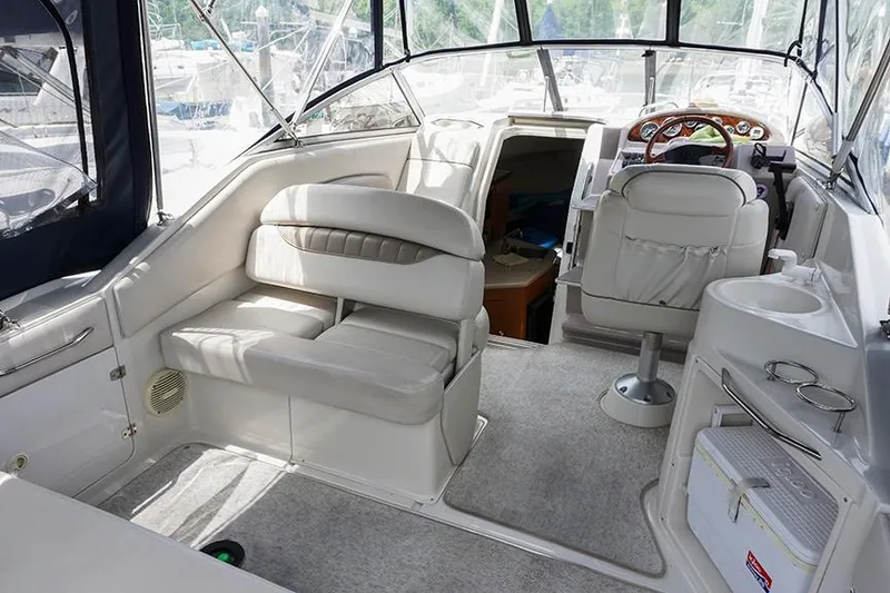 Slide: The Image of Interior of 2000 Regal Commodore 2660 boat with seating and helm. - 10
