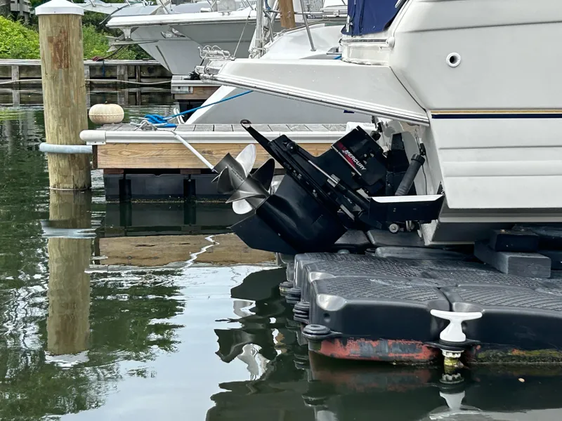 Slide: The Image of Regal Commodore 2660 boat docked, showcasing dual outboard motors, 2000 model. - 11