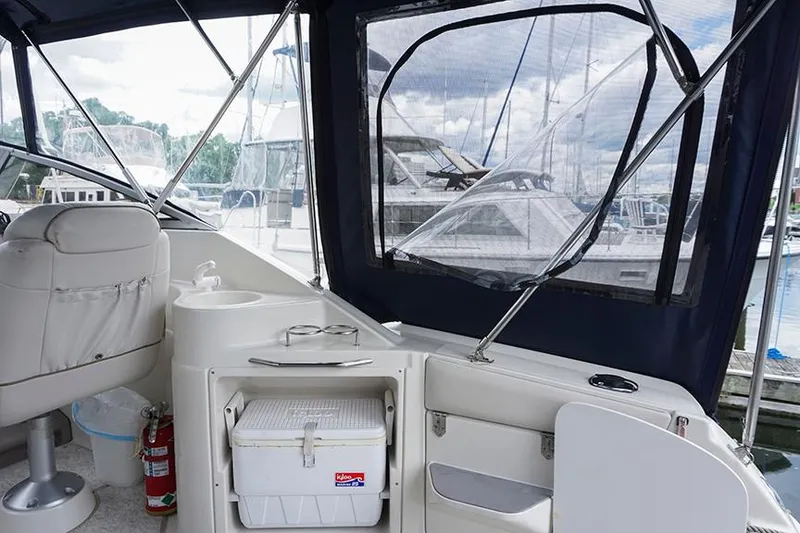 Slide: The Image of Interior of 2000 Regal Commodore 2660 boat with seating and storage. - 17