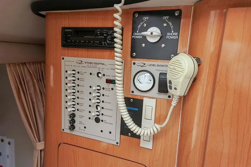 Slide: The Image of Control panel of a 2000 Regal Commodore 2660 boat with communication equipment. - 35