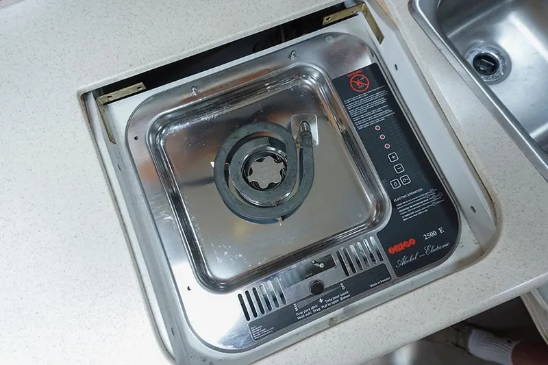 Slide: The Image of Stainless steel stove in 2000 Regal Commodore 2660 boat kitchen. - 37