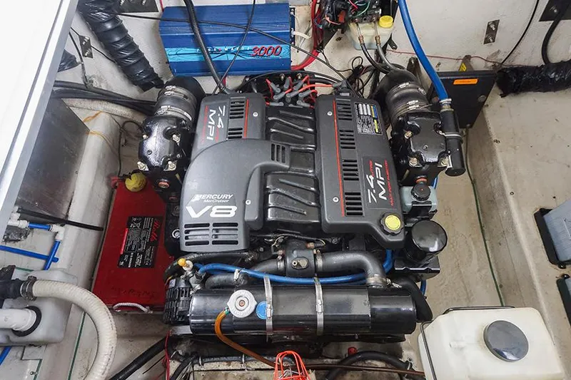 Slide: The Image of Engine compartment of a 2000 Regal Commodore 2660 with a Mercury V8 engine. - 42