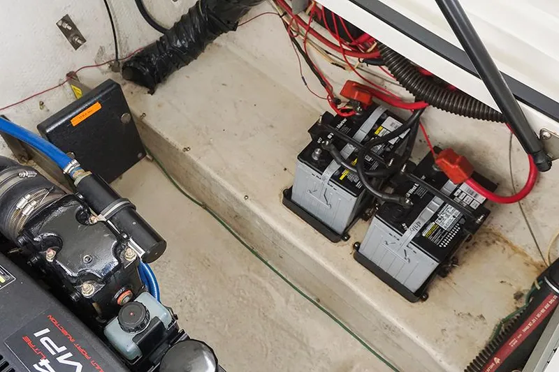 Slide: The Image of Engine compartment of a 2000 Regal Commodore 2660 with dual batteries and wiring. - 43