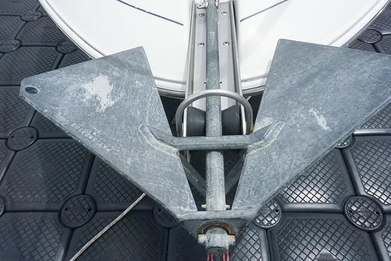 Slide: The Image of Anchor on Regal Commodore 2660 boat, 2000 model, with textured deck background. - 46