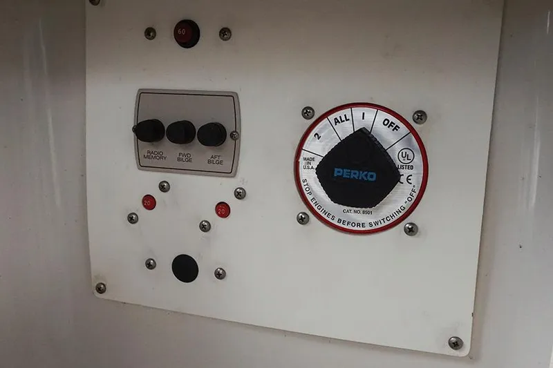 Slide: The Image of Control panel of a 2000 Regal Commodore 2660 boat with Perko switch. - 47