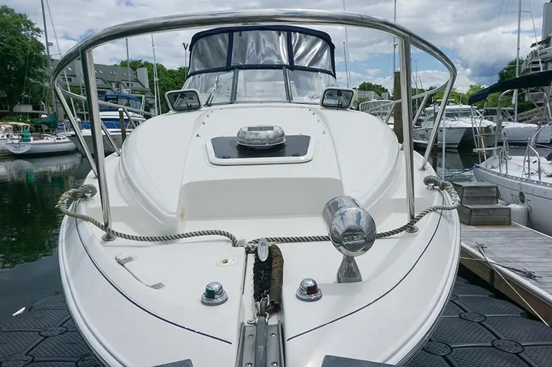 Slide: The Image of 2000 Regal Commodore 2660 boat docked at marina, front view. - 5