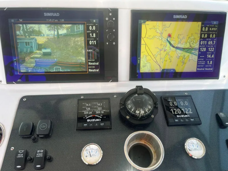 Slide: The Image of Control panel of a 2003 Pro-Line 30 WALKAROUND boat with navigation screens. - 12