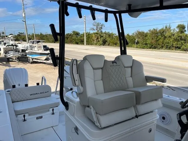 Slide: The Image of 2025 World Cat 295 CC boat interior with plush seating and modern design. - 5