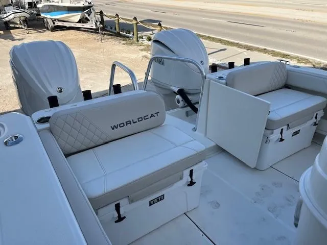 Slide: The Image of 2025 World Cat 295 CC boat interior with white seating and Yamaha engines. - 6