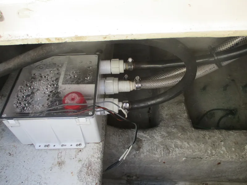 Slide: The Image of Engine compartment of 1997 Ocean Yachts 40 Super Sport with visible wiring and hoses. - 10