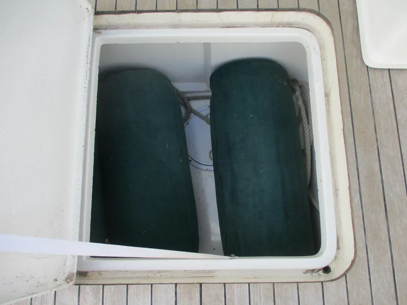 Slide: The Image of Open hatch on 1997 Ocean Yachts 40 Super Sport, revealing storage compartment. - 12