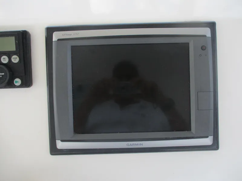 Slide: The Image of Garmin marine GPS device on 1997 Ocean Yachts 40 Super Sport dashboard. - 17