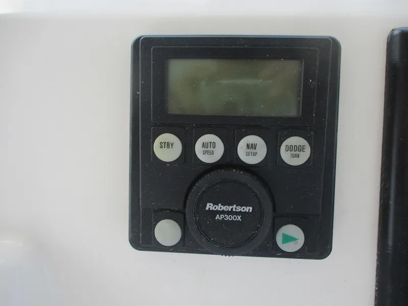 Slide: The Image of Control panel of a 1997 Ocean Yachts 40 Super Sport, featuring Robertson AP300X autopilot. - 18