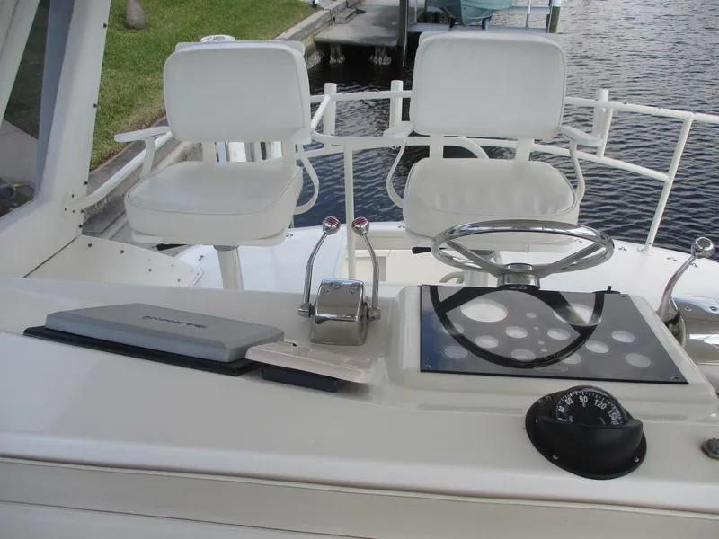 Slide: The Image of 1997 Ocean Yachts 40 Super Sport helm with dual seats and steering wheel. - 21