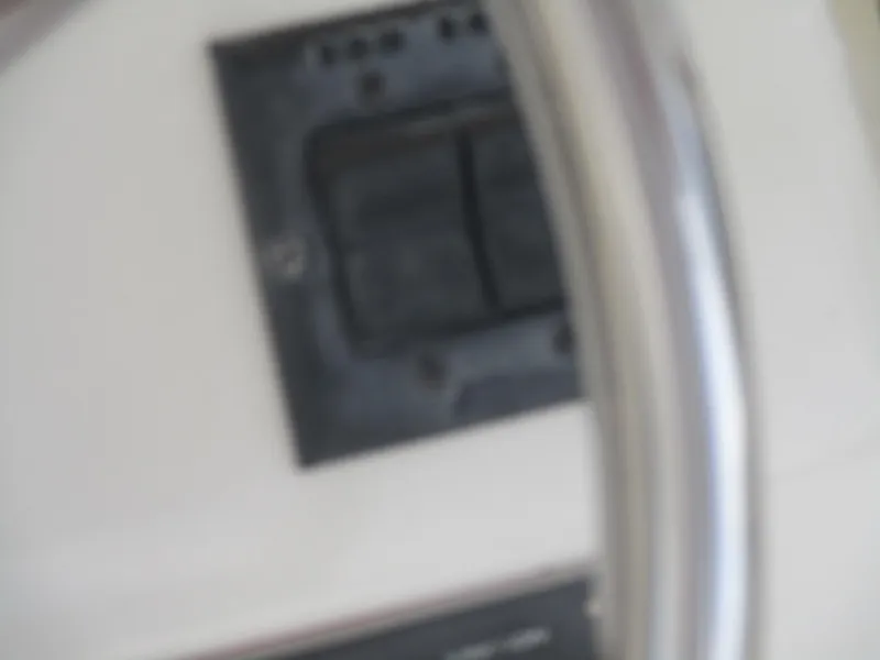 Slide: The Image of Blurred view of Ocean Yachts 40 Super Sport 1997 steering wheel and control panel. - 23
