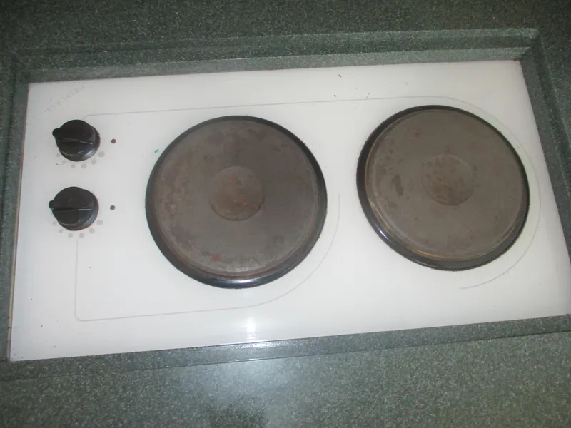 Slide: The Image of Two-burner electric stove on Ocean Yachts 40 Super Sport, 1997 model. - 28