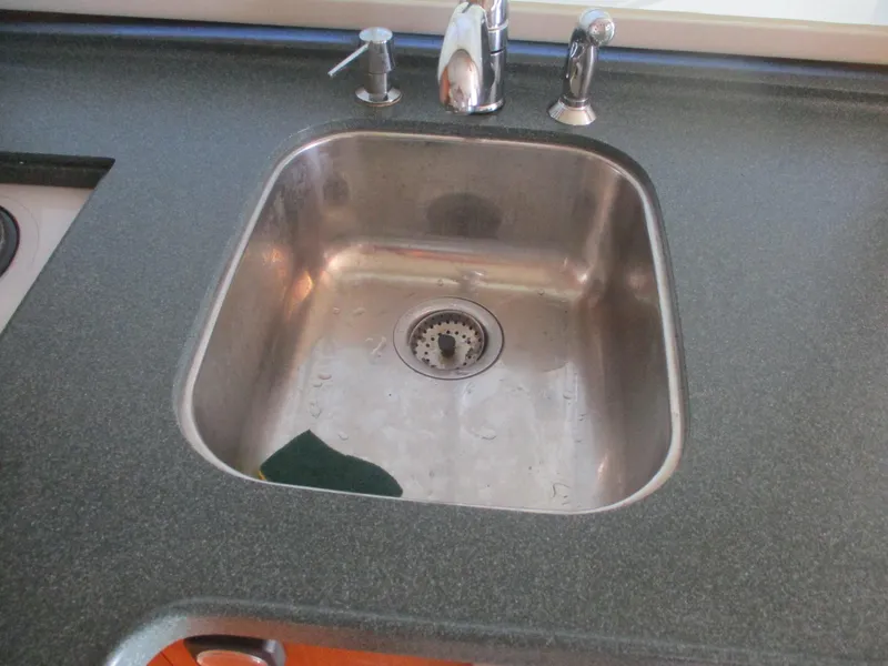 Slide: The Image of Stainless steel sink with faucet on Ocean Yachts 40 Super Sport, 1997 model. - 29