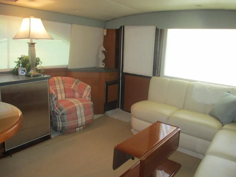 Slide: The Image of Luxurious interior of 1997 Ocean Yachts 40 Super Sport with cozy seating and elegant decor. - 36