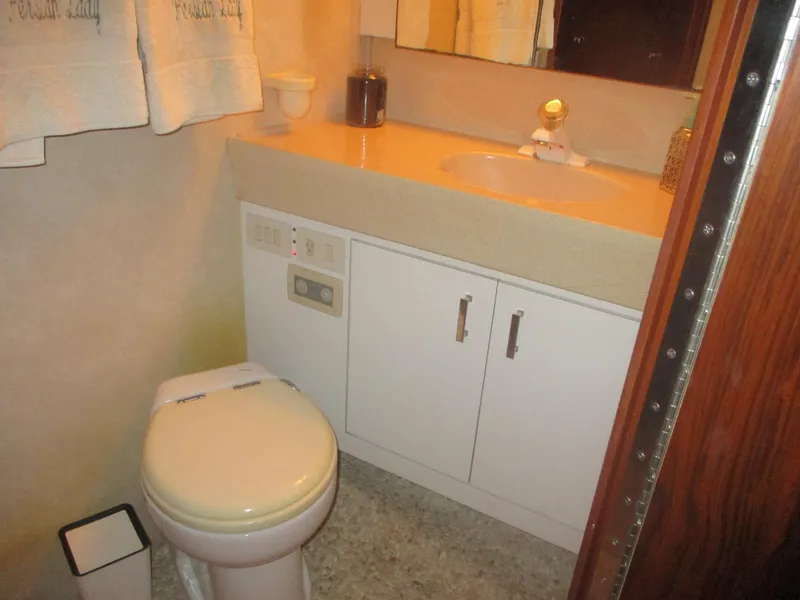 Slide: The Image of Bathroom interior of 1997 Ocean Yachts 40 Super Sport with sink and toilet. - 38