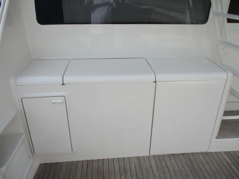 Slide: The Image of 1997 Ocean Yachts 40 Super Sport deck with white storage compartments. - 4