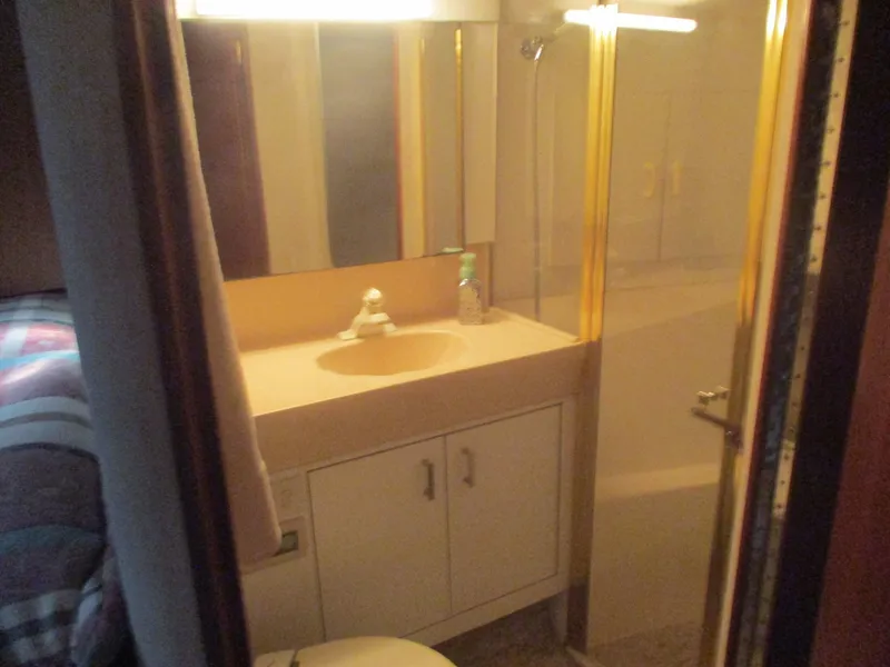 Slide: The Image of Bathroom interior of 1997 Ocean Yachts 40 Super Sport with sink and shower. - 41
