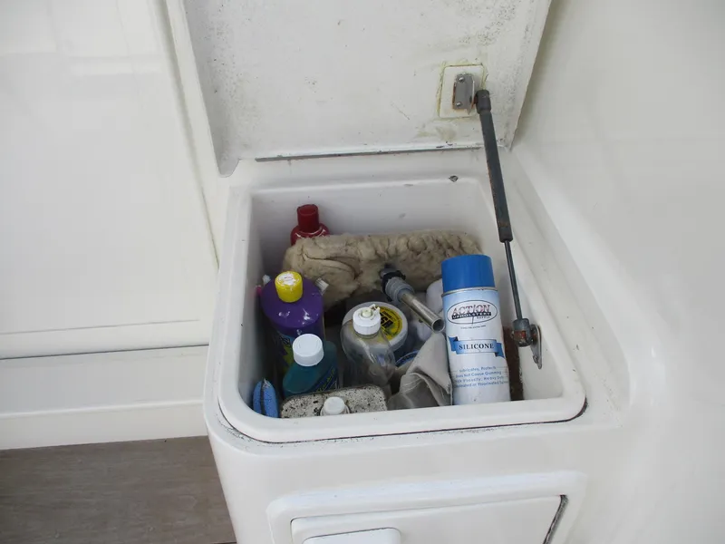 Slide: The Image of Storage compartment on a 1997 Ocean Yachts 40 Super Sport with cleaning supplies. - 8
