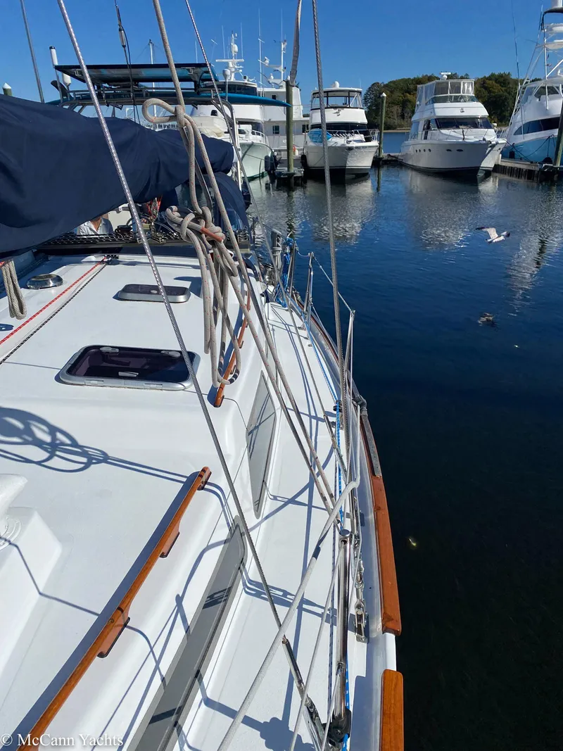 Slide: The Image of 1973 Challenger 40 sailboat docked in a marina with other boats. - 2