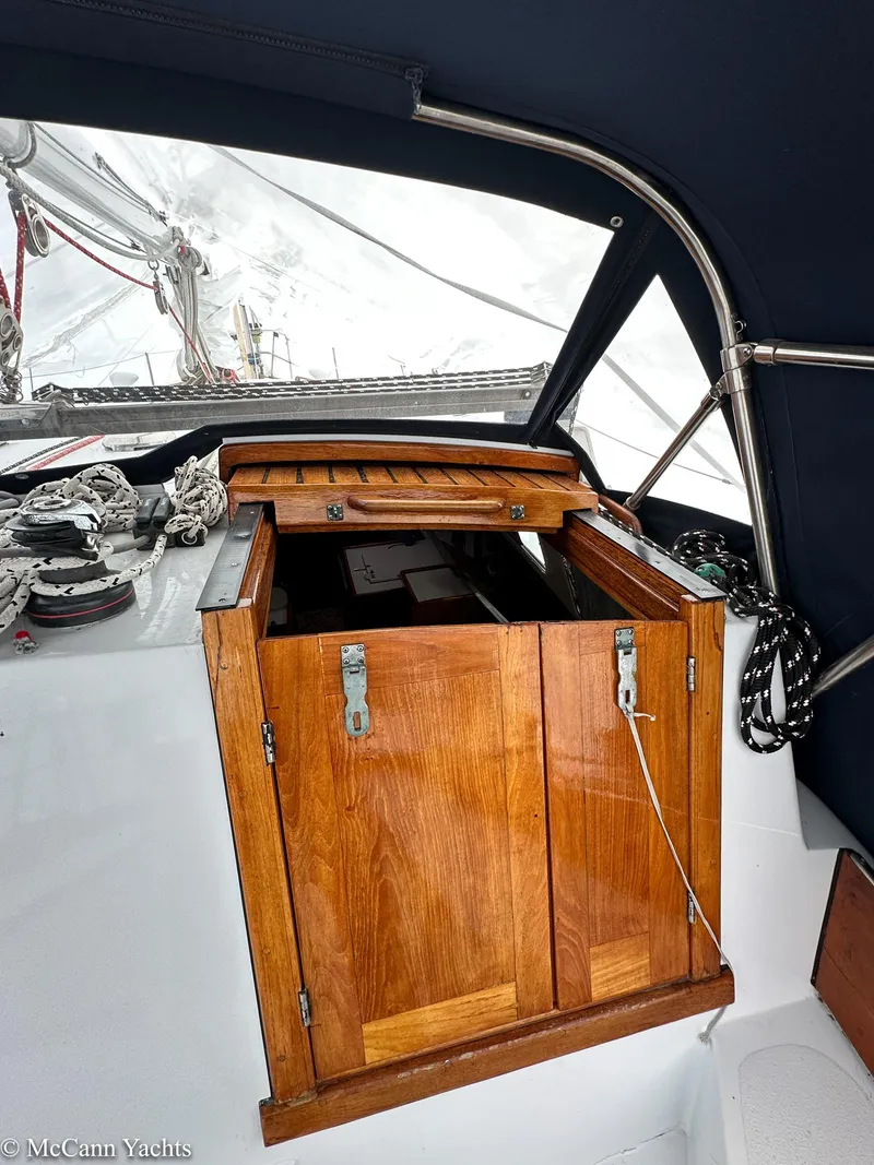 Slide: The Image of Wooden hatch on 1973 Challenger 40 sailboat, open to cockpit with visible rigging. - 43
