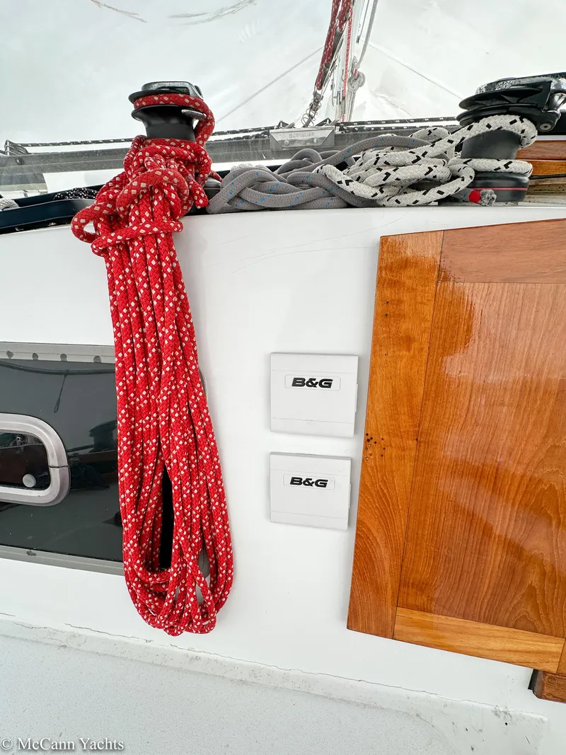 Slide: The Image of 1973 Challenger 40 sailboat deck with ropes and B&G instruments. - 44