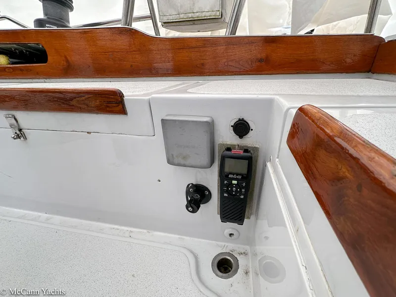 Slide: The Image of 1973 Challenger 40 yacht cockpit with radio and wooden trim details. - 47