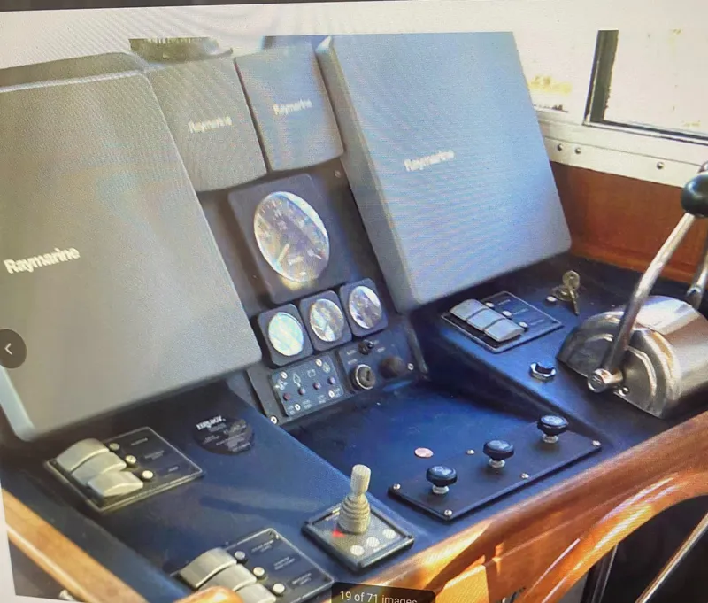 Slide: The Image of Control panel of a 2003 American Tug 34 with Raymarine navigation equipment. - 9