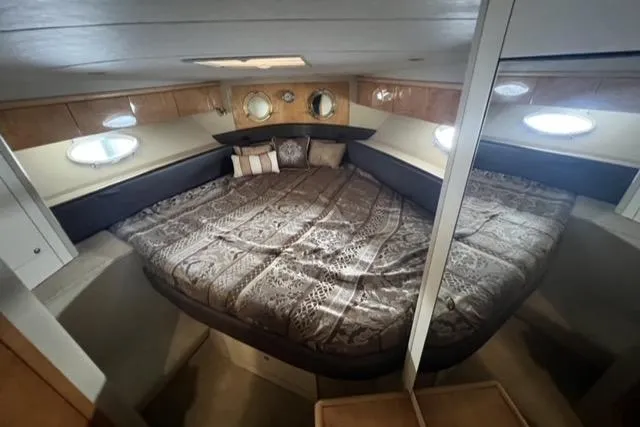 Slide: The Image of Luxurious cabin interior of a 1994 Sunseeker Camargue 55 yacht with a spacious bed. - 13